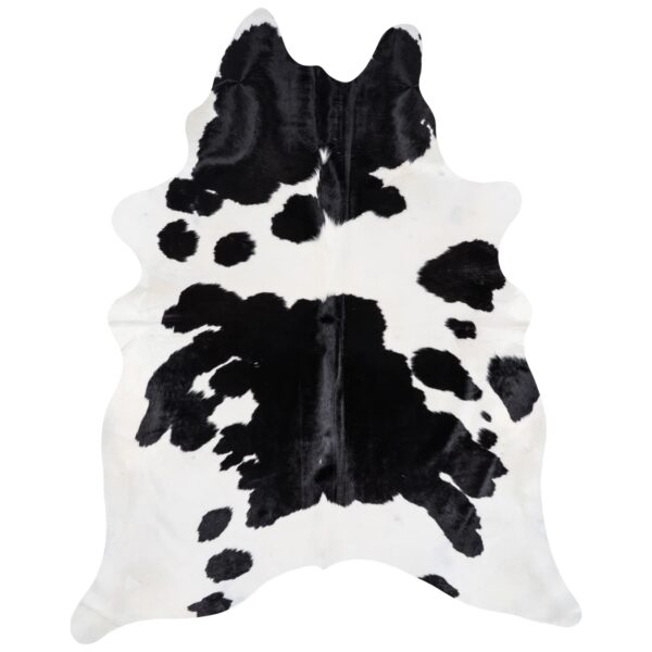 Black and white cowhide rug with minimal center markings and edge spots