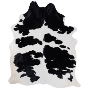 Distinctive black and white cowhide rug with bold symmetrical pattern