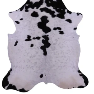 Classic black and white cowhide rug with natural spotted pattern