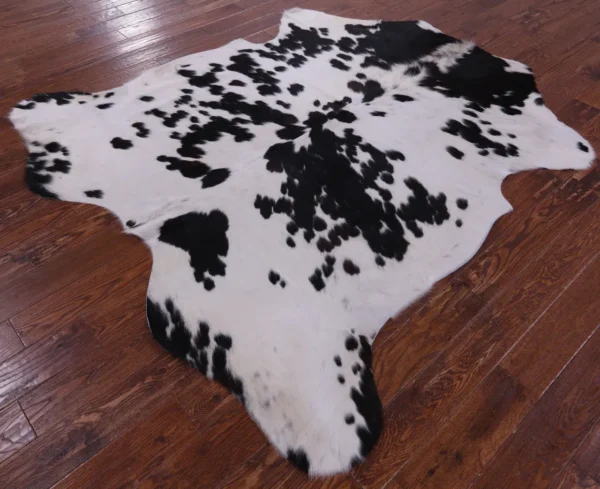 Dappled Salt and Pepper Cowhide Rug in a cozy setting