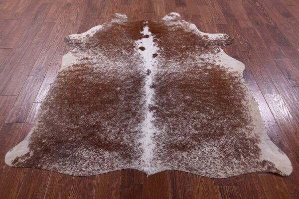 Chestnut Cowhide Rug in Rustic Reading Corner